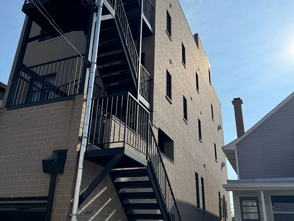 Back of building, back staircase and part of garage.