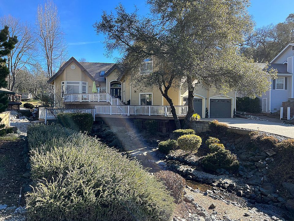 Street view of entire house, rental is above garage area