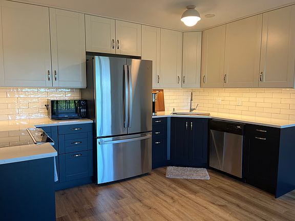Stainless steel appliances, convection oven and quartz countertops.