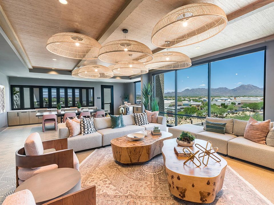 Relax, socialize, or unwind in the expansive resident lounge with curated textures, ample seating, and a warm, modern design.