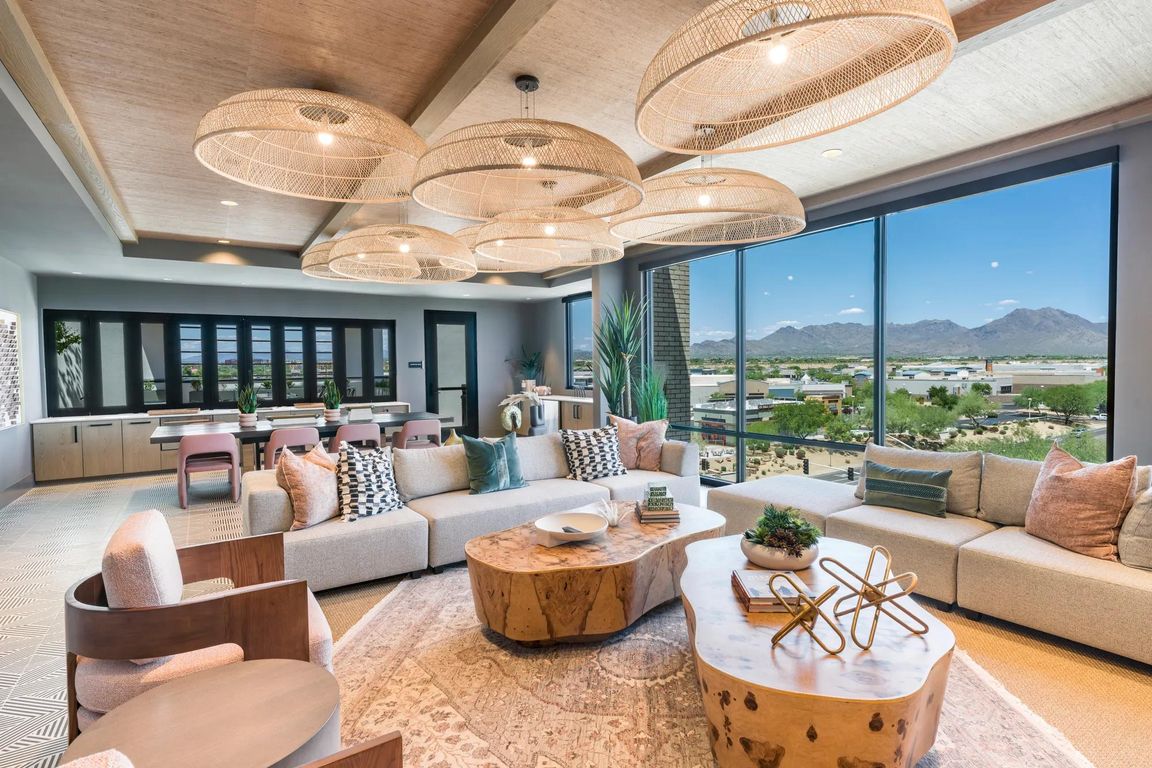 Relax, socialize, or unwind in the expansive resident lounge with curated textures, ample seating, and a warm, modern design.