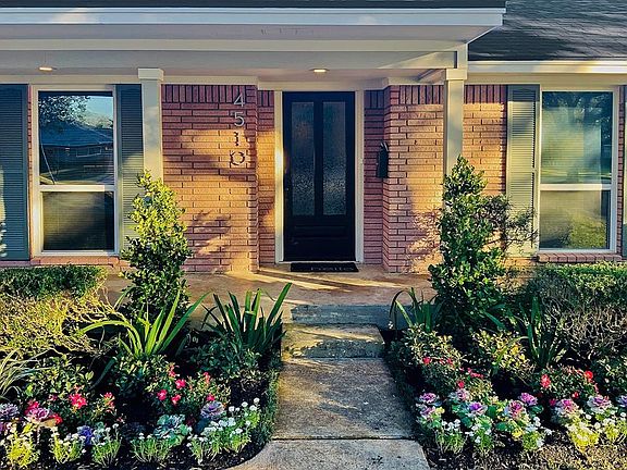 Entry: 20 foot covered porch with recessed lighting and columns , Mahogany door with Flemish glass, meticulous landscaping with irrigation.