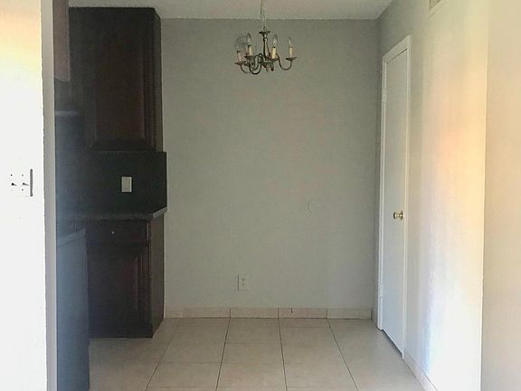 View of tiled kitchen from family room