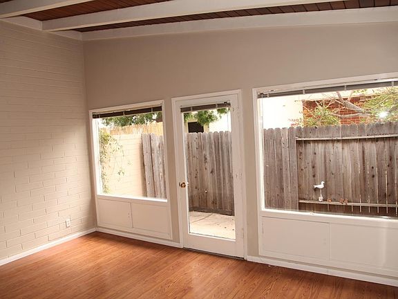 Private fenced rear patio. Large windows for a bright open feel apartment. Open beam ceiling.