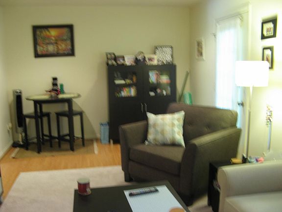 living/dining room area; laminated wood flooring