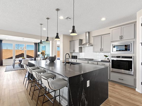 Enhance your home with upgrades like black granite countertops and overhead pendant lighting.