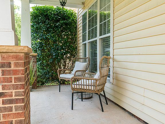 Cozy front porch with plenty of room for sitting.