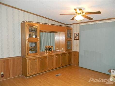 The dining room has laminate flooring.