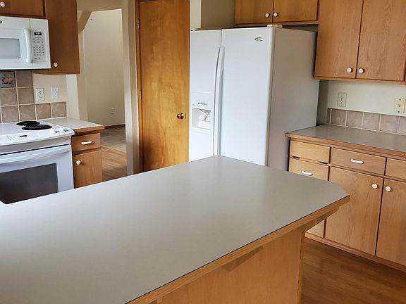 Kitchen with lots of cupboards and a pantry