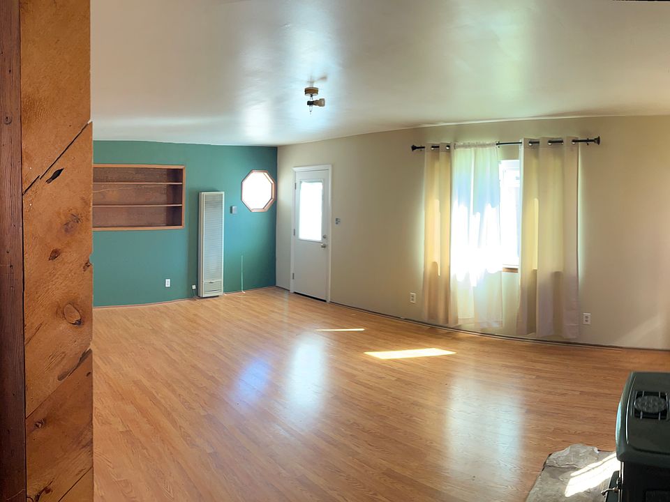 private living room + stairs leading to upstairs master bedroom