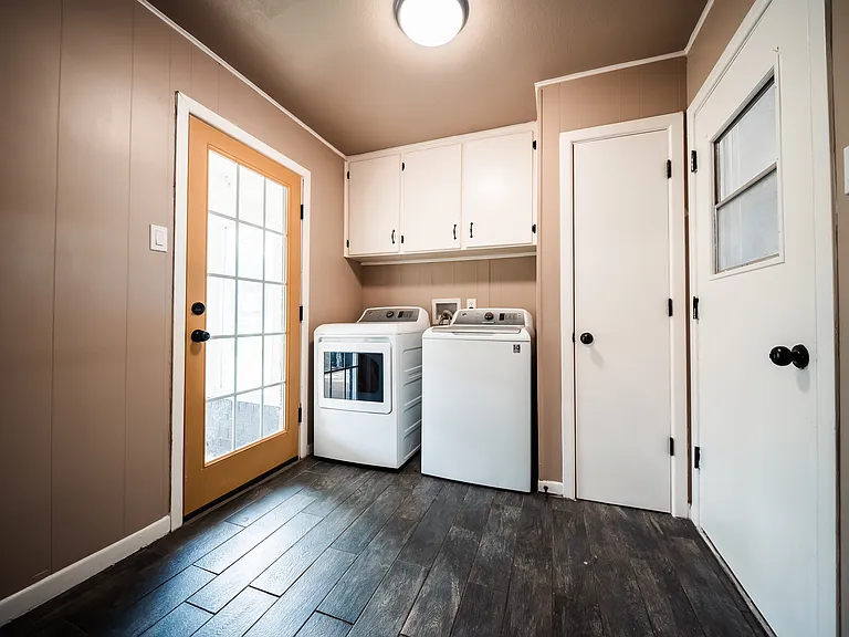Dedicated laundry room with washer and dryer hookups