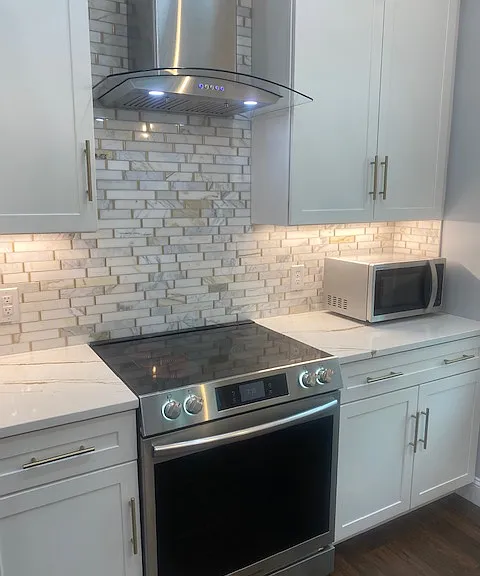 High Modern litchen with stainless appliances.