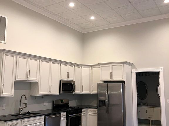 Kitchen and bathroom entry.