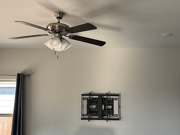 Living room TV mount can stay. Ceiling fans throughout.