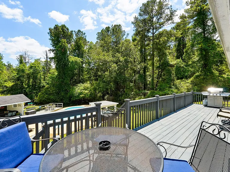 Upper back patio with outdoor furniture & BBQ gas grill off Main Level Living Room