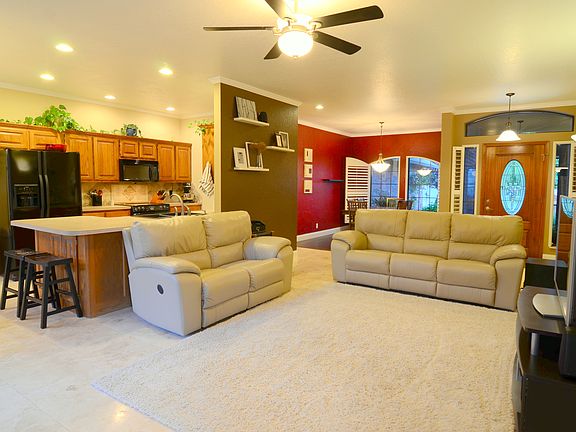 The living room, kitchen, and 2nd dining room have gorgeous travertine floors.