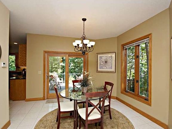 Spacious ceramic tiled informal dining room right off the kitchen for your family time meals.