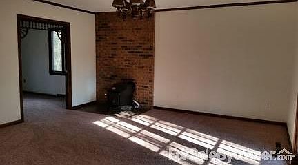 room off kitchen, with wood stove