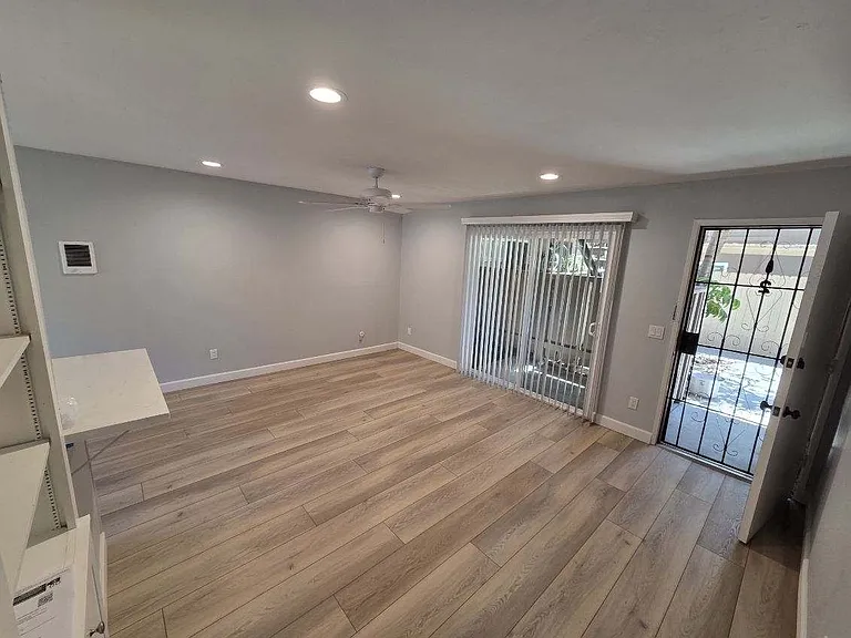 Screened in front door and access to a private patio.