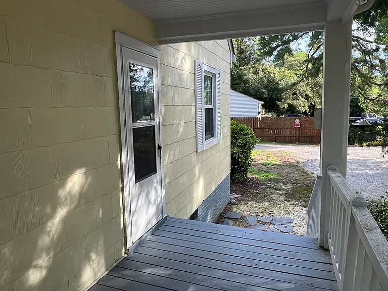 smaller covered side porch (east side)