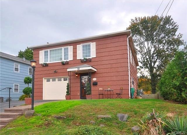 Fenced in backyard safe for children's play. Rear deck for outdoor dining and entertaining.