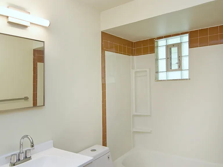 Freshly painted bathroom has all new vanity with new faucet fixtures, new toilet, new LED lighting and new LVP flooring.