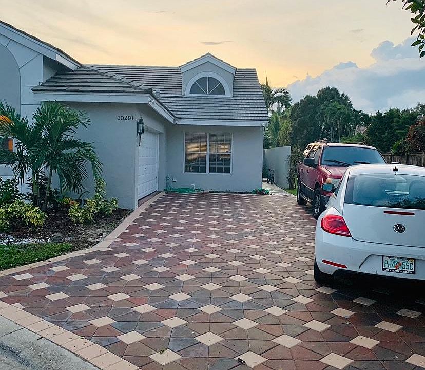 two car garage and paved driveway
