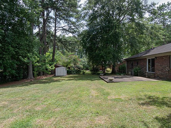 FULLY FENCED IN BACK YARD with TOOL SHED