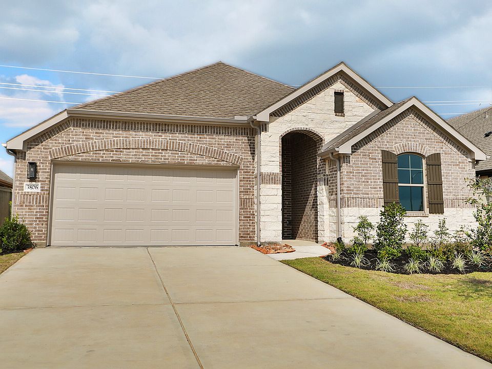 Elegant Westland Ranch home showcases refined brickwork, custom shutters, and lush landscaping, offe