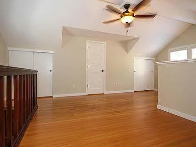 Loft showing closets and entrance to bathroom.