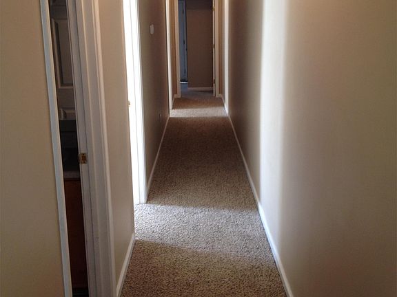 Hallway first door to left is bath with laundry full tub and