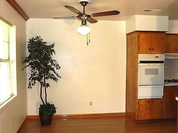 Breakfast area is open to the kitchen and den.