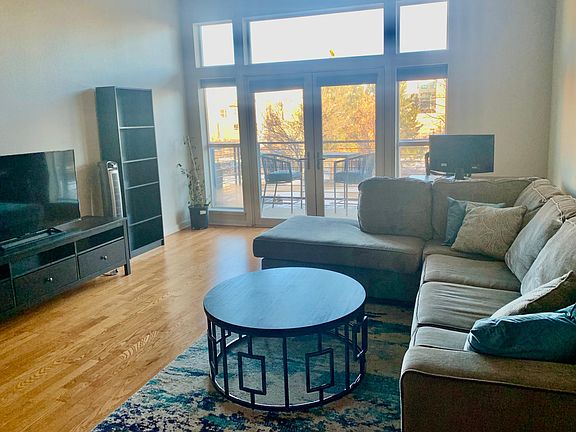 Spacious Living Room with large windows.