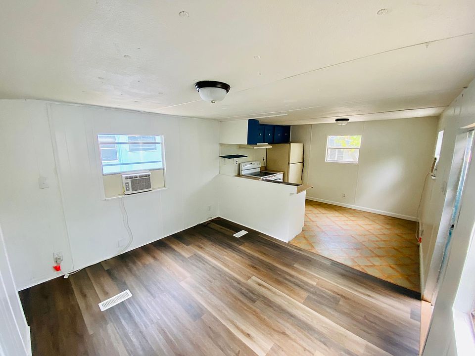 Open floor plan with fresh paint and new flooring.