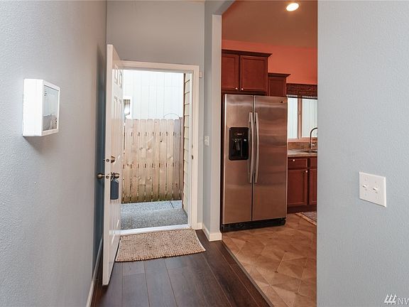 Front door with kitchen on right.