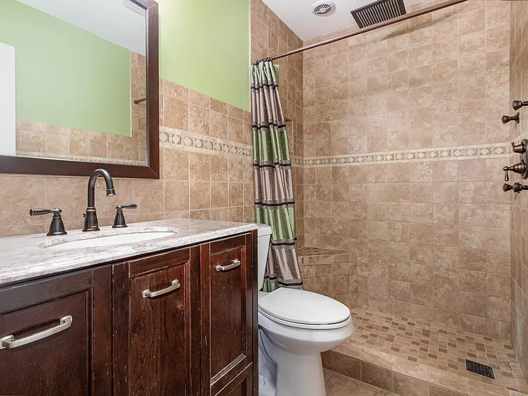 Master Bedroom Full bathroom. Ceiling Mounted shower system with body jets. Bluetooth speaker system.