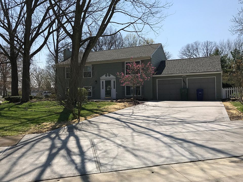 Corner lot with mature trees and large new concrete driveway.