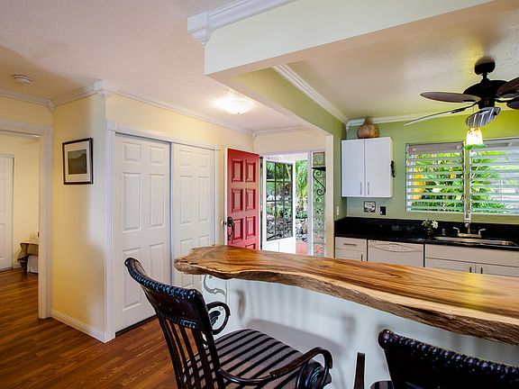 Kitchen with monkey pod counter top