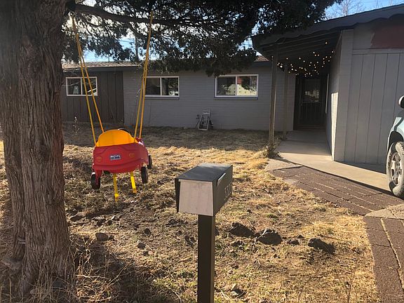 Front of house-- 3 off street parking spaces in front of garage (right).