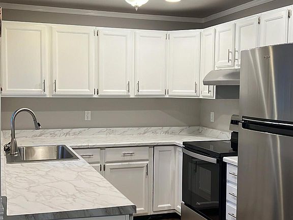 New stainless steel appliances, countertop, deep sink and garbage disposal.