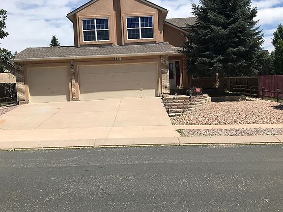 Front xeriscape , stucco 3 car