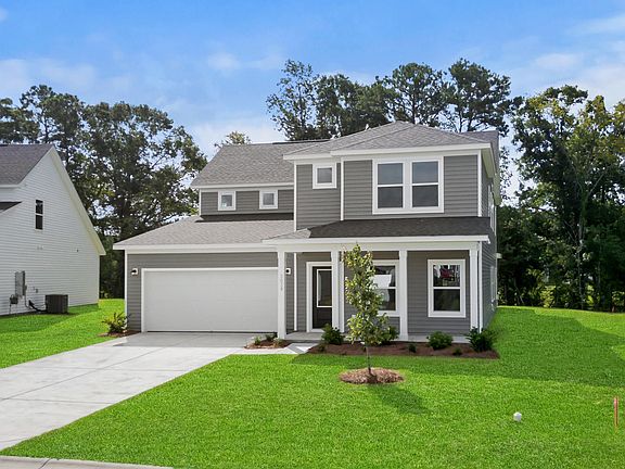 Inviting curb appeal with thoughtful architectural details.