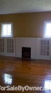 Living Room
						:
						This room has built in bookshelves and gas logs in the fireplace