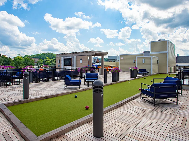Bocce ball on the rooftop surrounded by comfortable outdoor seating options