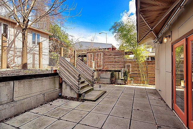 Your private, low maintenance back yard with retractable awning, shown here partially extended.