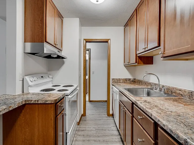 Welcome to Central Lakes of Uptown, where modern living meets comfort. This stylish kitchen boasts elegant cabinetry, sleek appliances, and ample space for culinary creativity. Elevate your lifestyle todayschedule a tour and see for yourself!