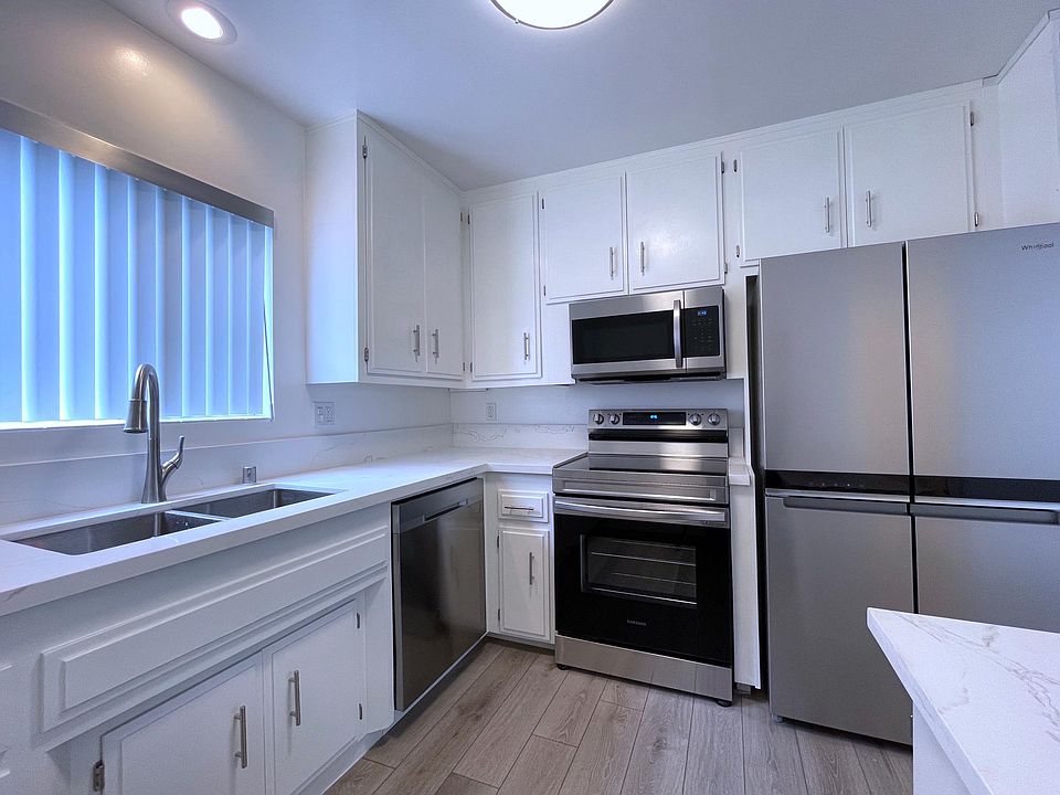 Kitchen with all-new Samsung and Whirlpool appliances