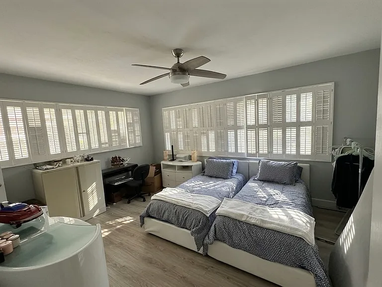 Master Bedroom
Oversized master bedroom with wall-to-wall plantation shutters, gorgeous natural light, and hardwood-style floors

Furniture included if desired