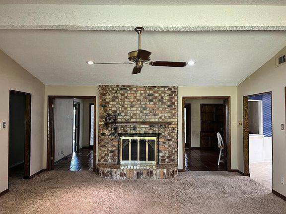 View from Great Room into Sun Room showing gas fireplace
