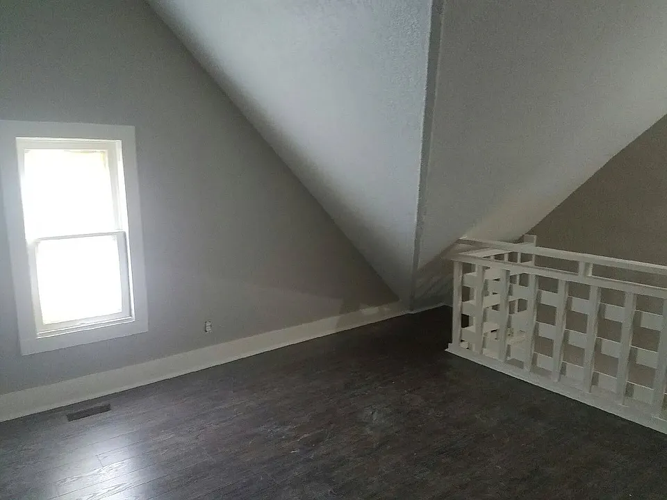 Step into this charming space at LS Capital Group, featuring unique architectural angles and abundant natural light. Ideal for personal touches, this room offers comfort and potential. Don't miss your chance. Schedule a tour today!